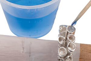 Blue resin being placed into cones